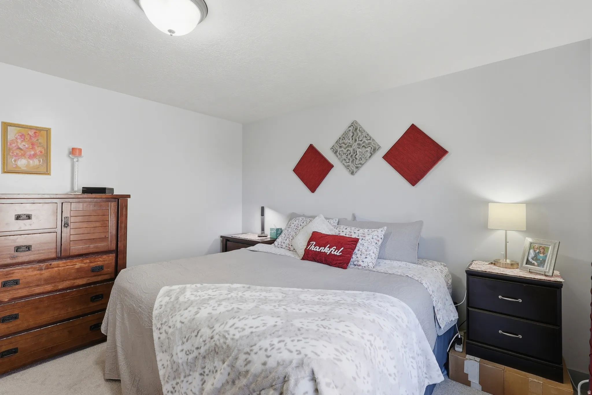 Interior room featuring light-colored walls and carpet flooring