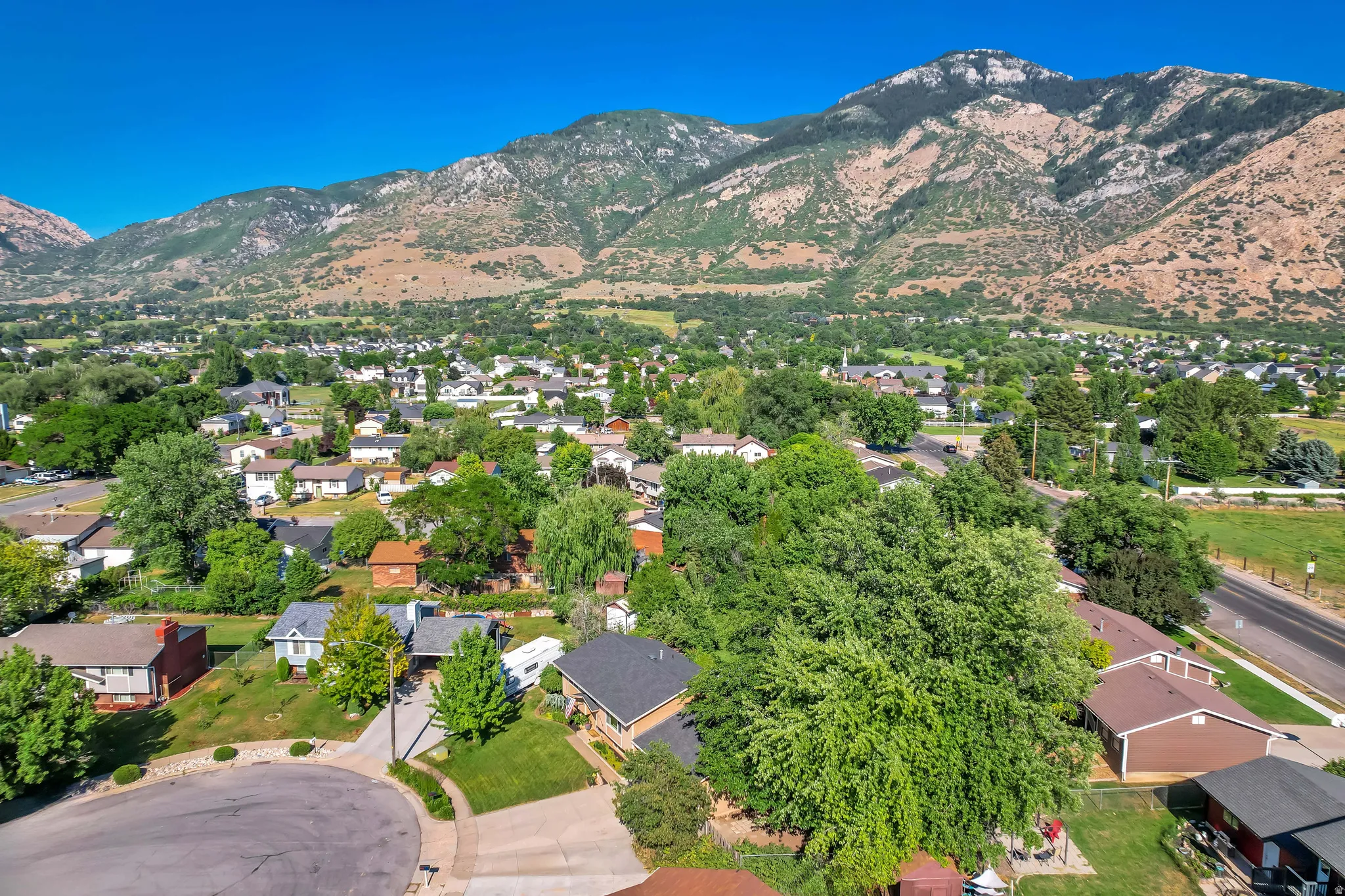 Community setting with mountain backdrop and residential properties