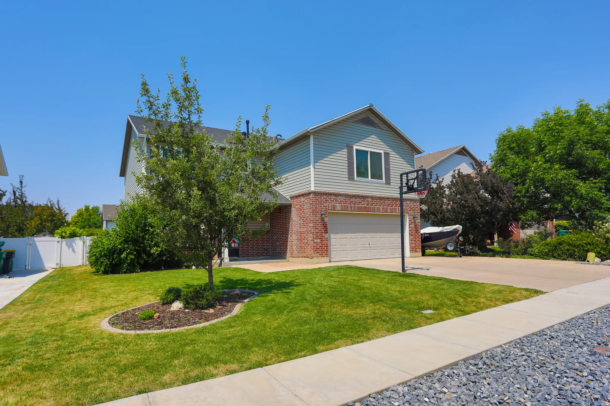 Two-story residence featuring a brick and siding exterior