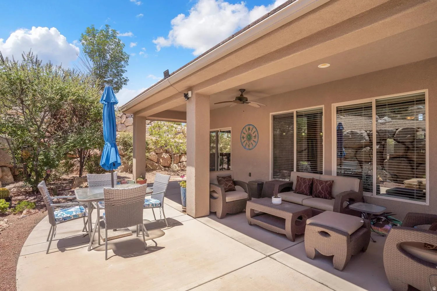 Expansive covered patio with recessed lighting and a ceiling fan