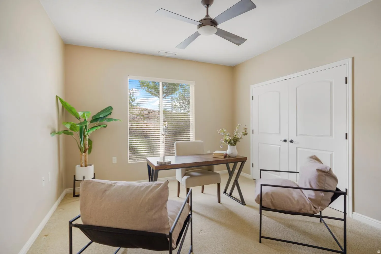 Recessed lighting, ceiling fan with integrated light, carpet flooring, window with horizontal blinds, and paneled double doors
