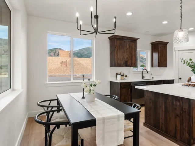 Open-concept living space with light wood-finish flooring