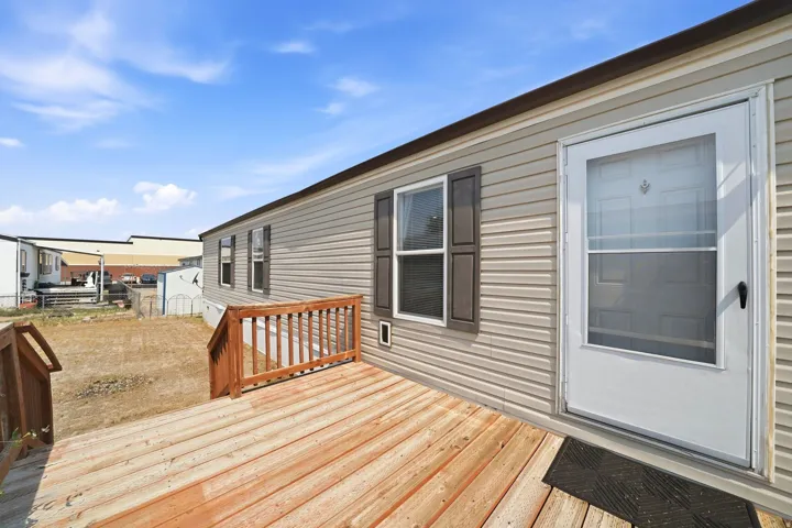 Expansive wood-finish decking featuring a natural wood-tone railing system