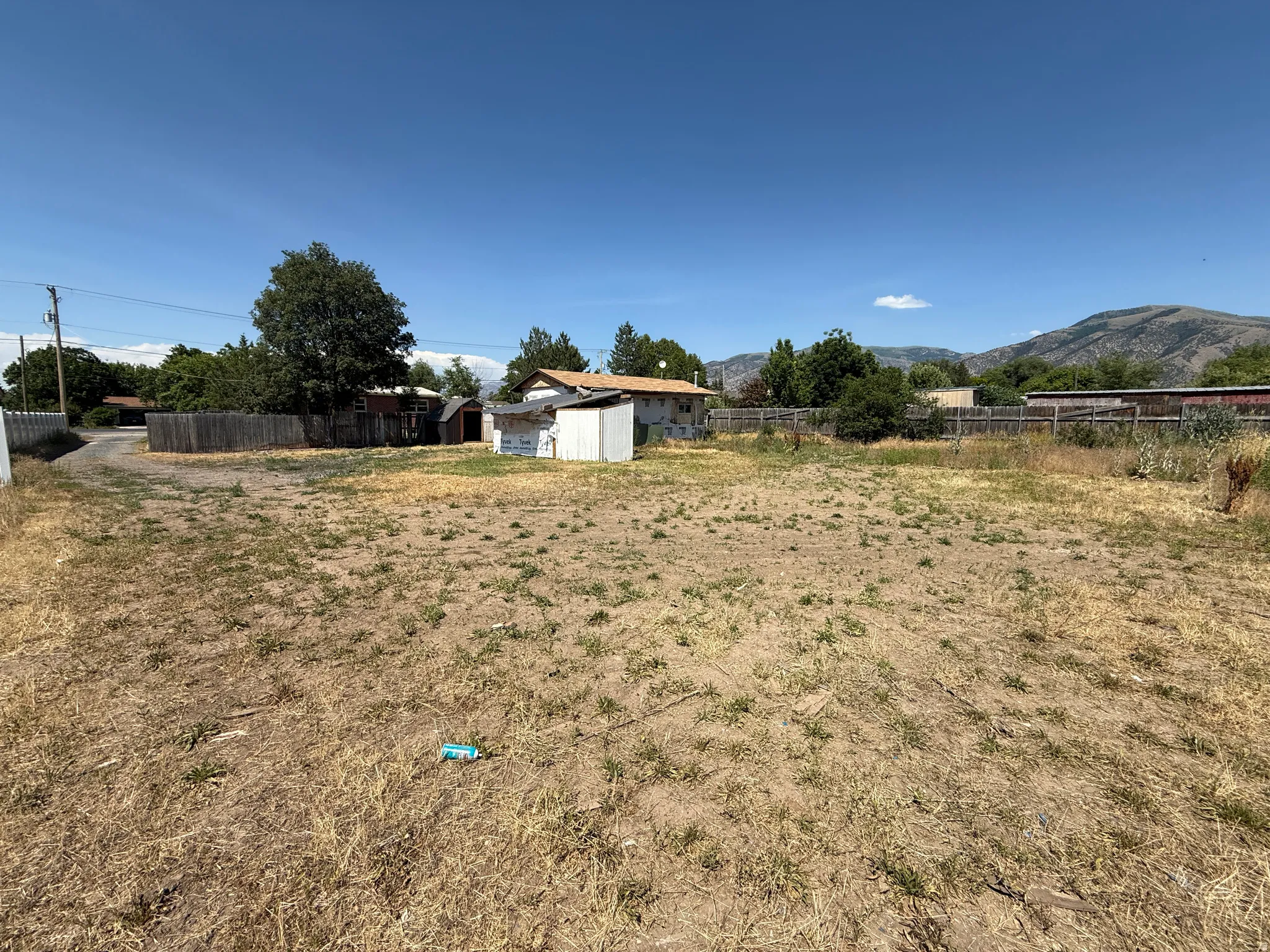 Expansive undeveloped lot featuring a natural landscape and surrounding mountain scenery