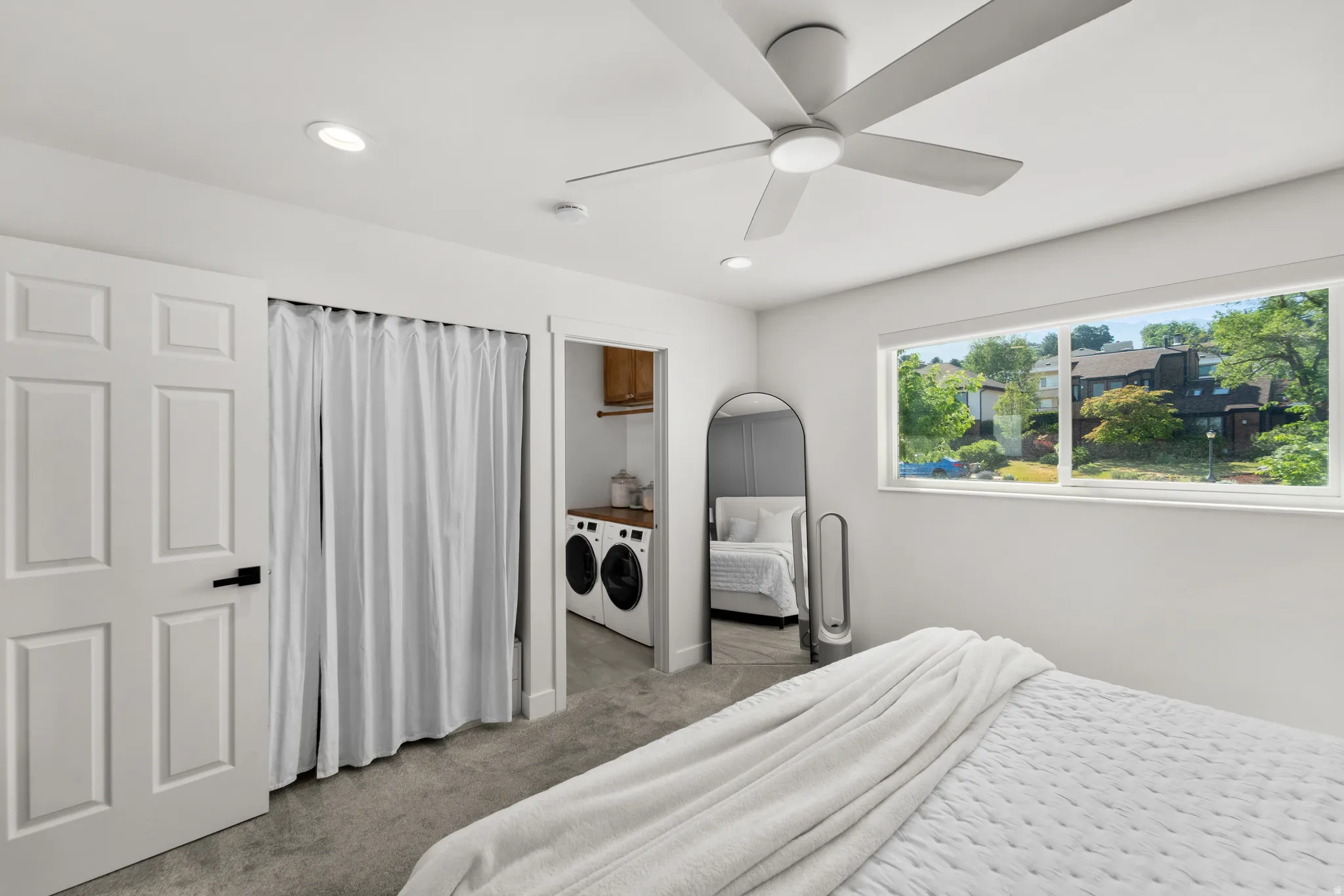 Room featuring a ceiling fan with integrated lighting, recessed ceiling lights, and wall-to-wall carpeting