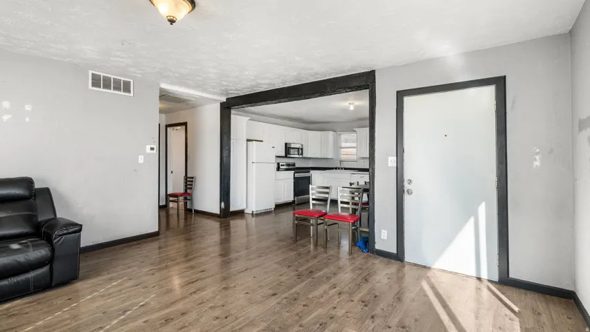 Wood-finish flooring throughout, with a neutral wall palette