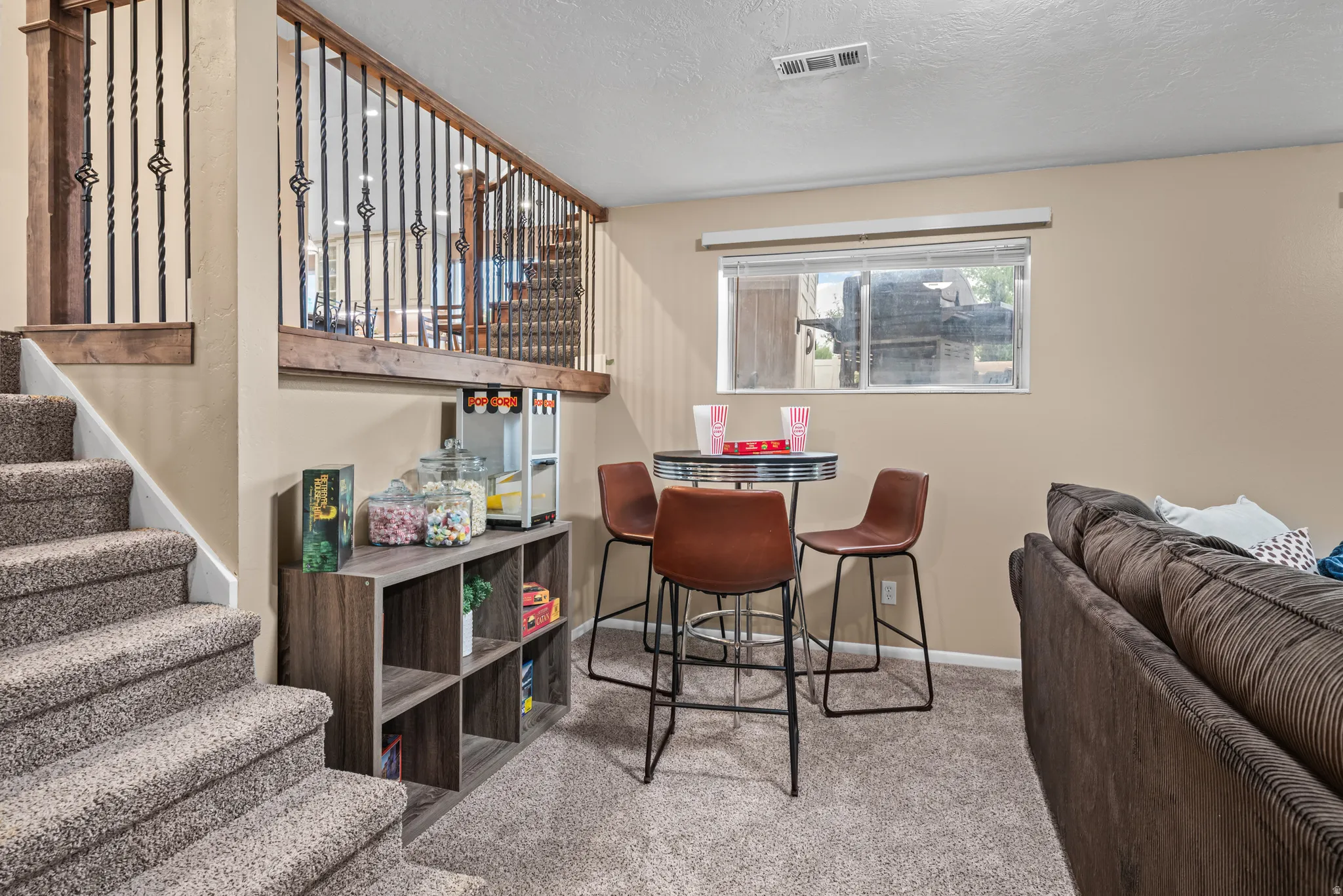 Lower level space featuring carpet flooring and neutral wall tones