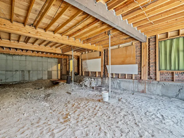 Exposed joists and subflooring define the ceiling structure