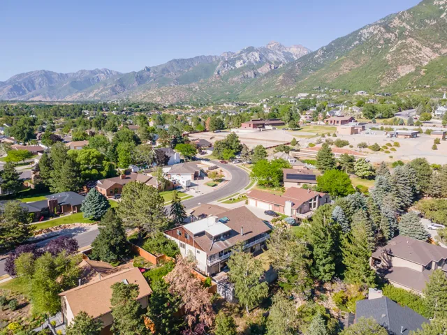 Expansive mountain backdrop framing a residential area with varied architectural styles