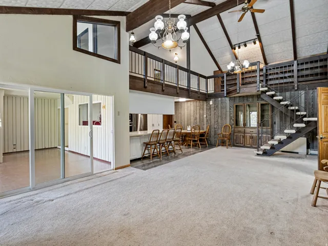 Soaring vaulted ceilings with exposed wood beams