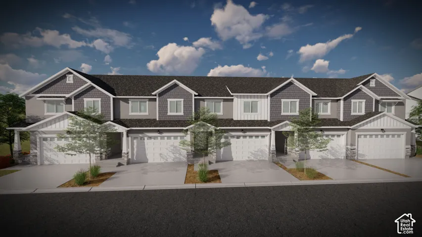 Modern townhome facade featuring a two-car garage, stone accents, shingle siding, and gabled rooflines