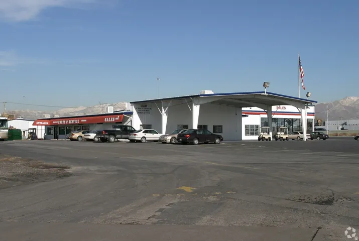 Commercial property featuring a large asphalt parking lot