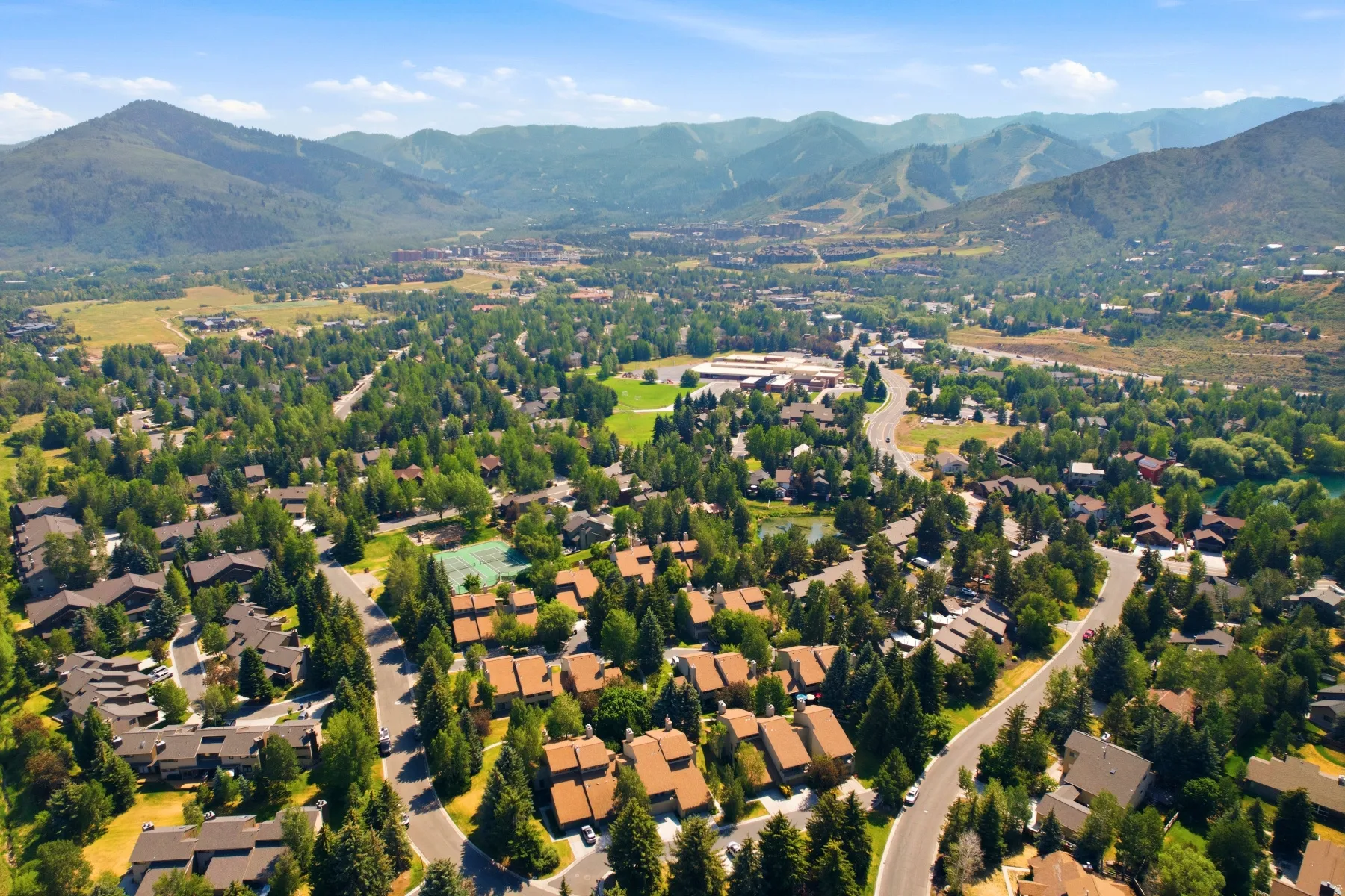 Sprawling residential development set against a mountainous backdrop