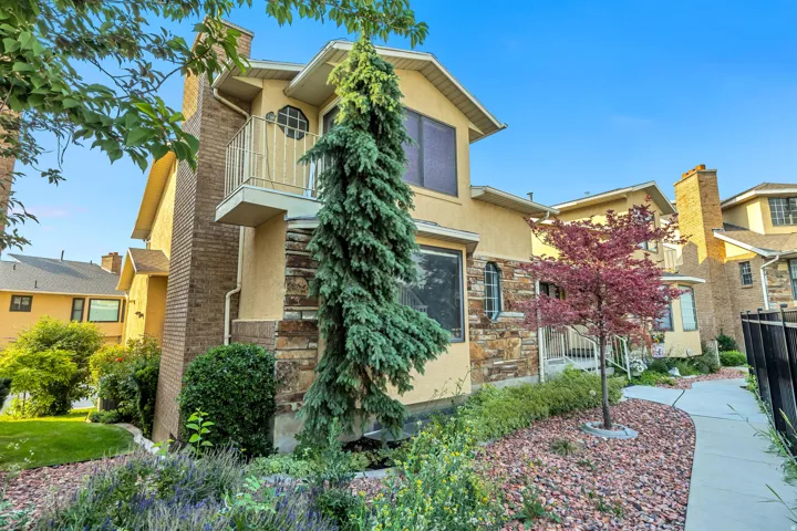 Stucco exterior with stone veneer accents