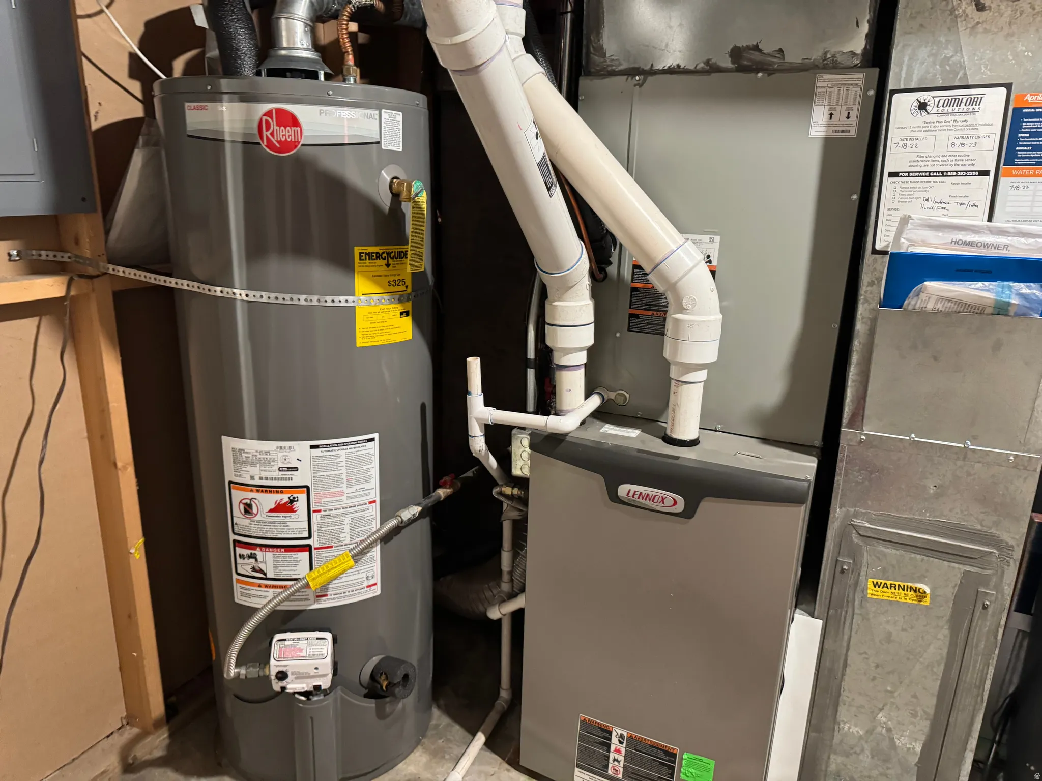 Rheem water heater and Lennox furnace installation featuring PVC piping and galvanized ductwork