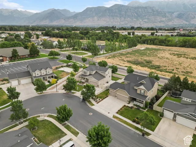 Aerial perspective showcasing a residential community with distant mountain ranges