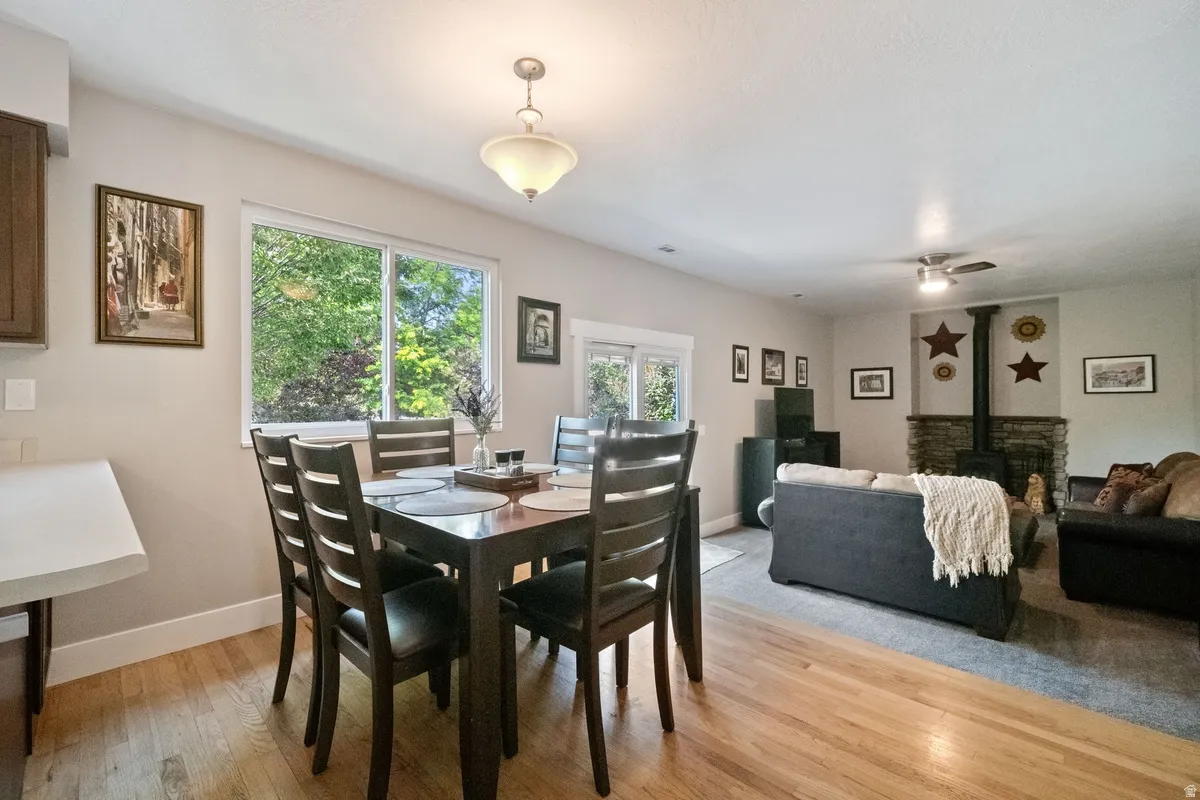 Dining area with wood-finish flooring and a large window