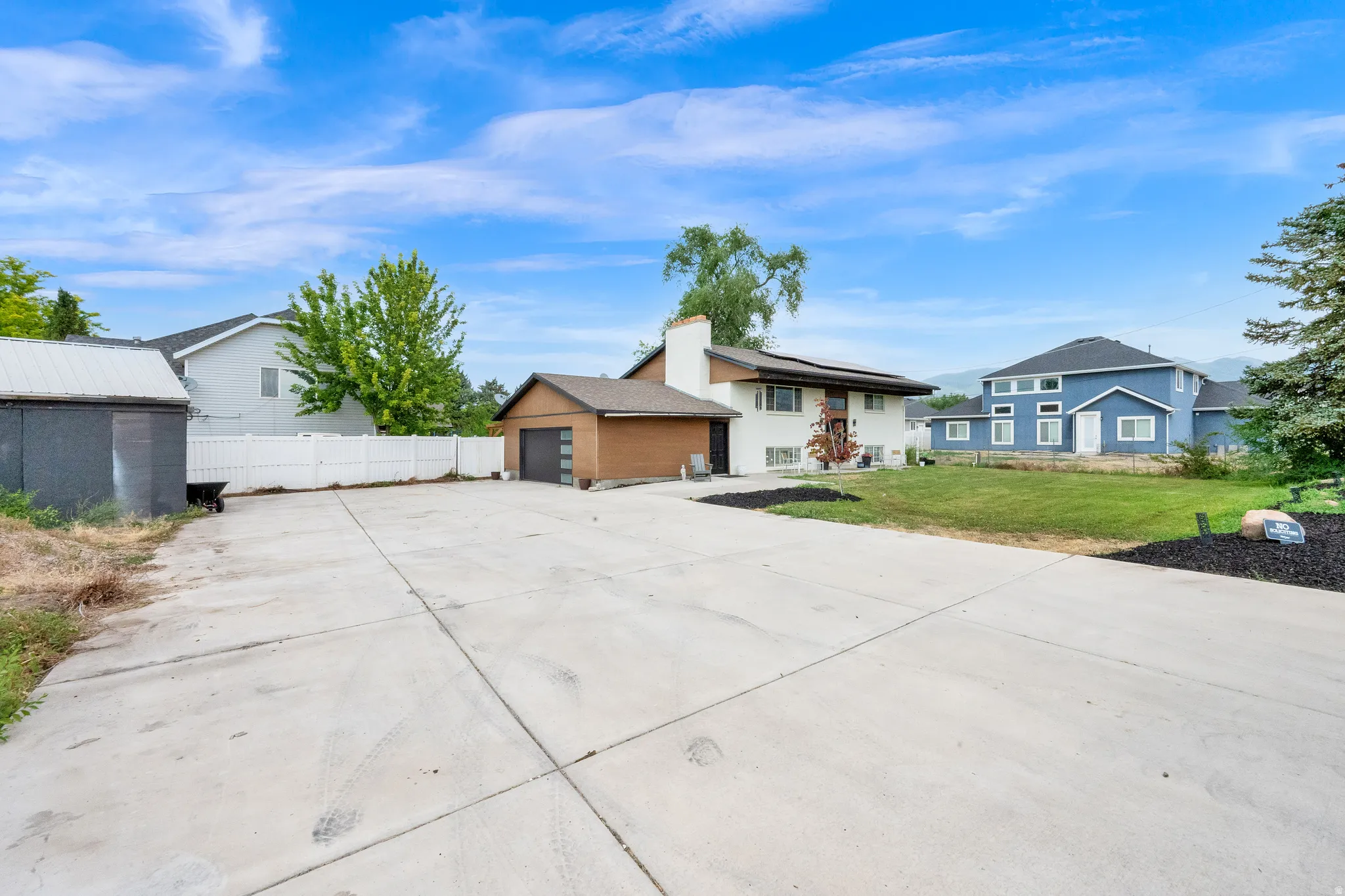 Expansive concrete driveway and parking area