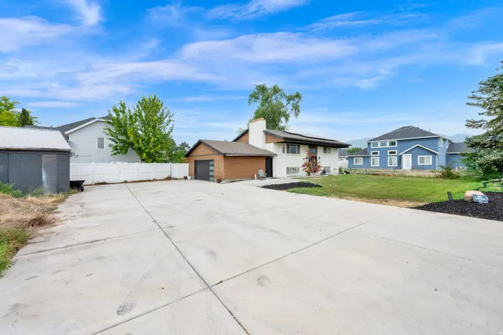 Expansive concrete driveway and parking area
