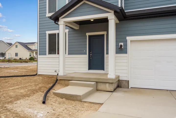 Contemporary exterior featuring blue horizontal siding and white shiplap-style accents