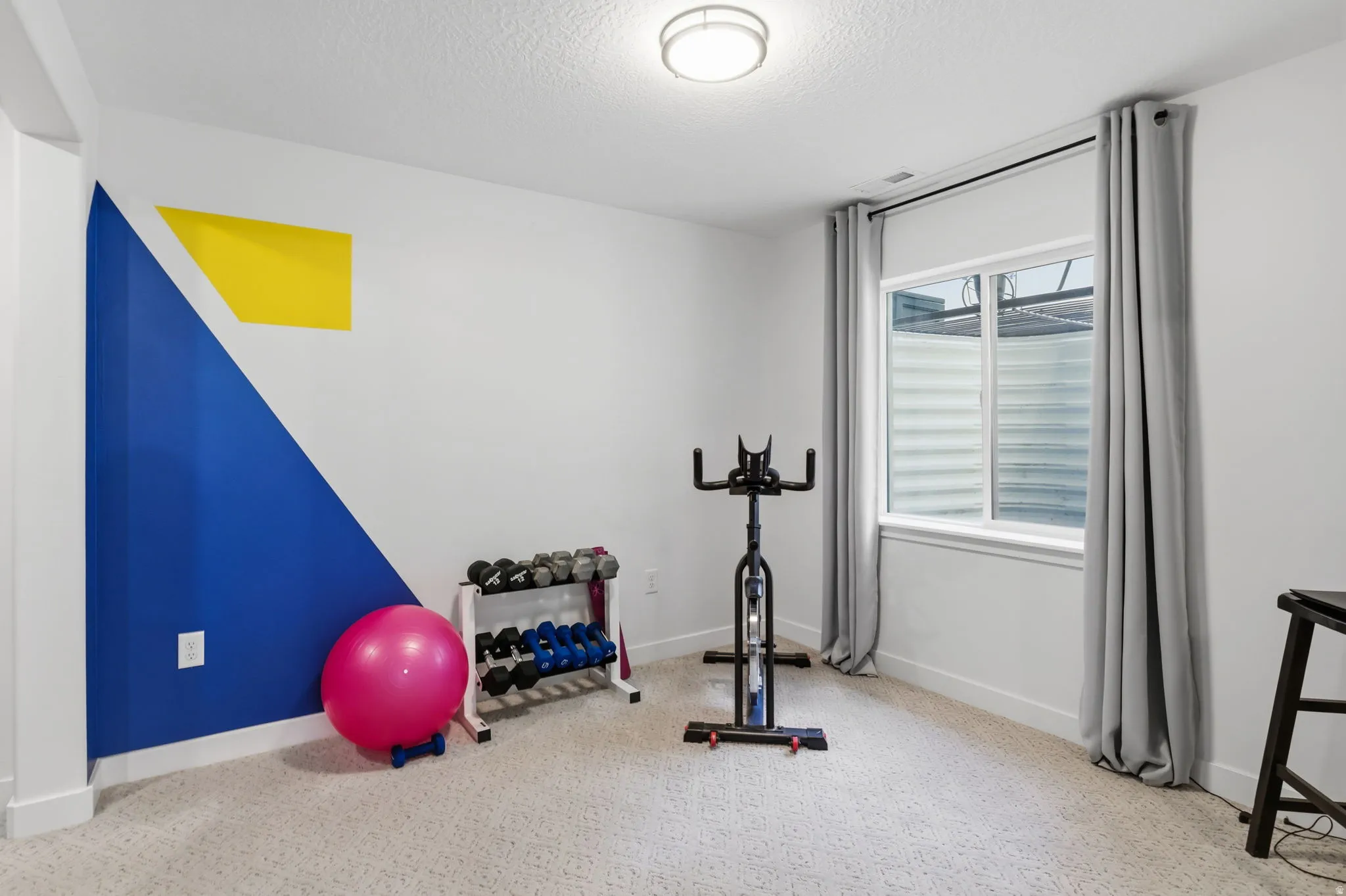 Basement bedroom utilized as exercise room