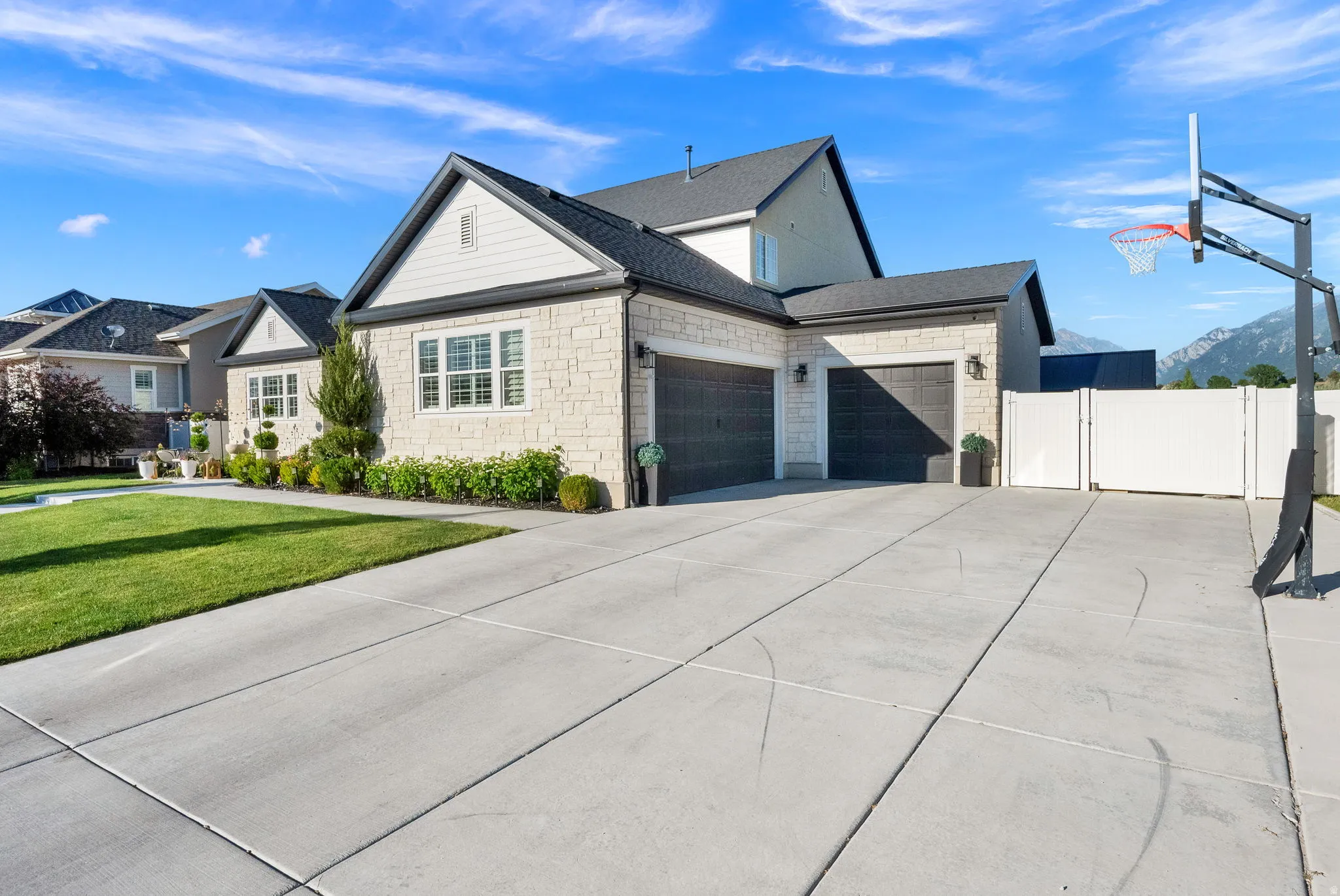 Contemporary residence featuring stone and siding exterior