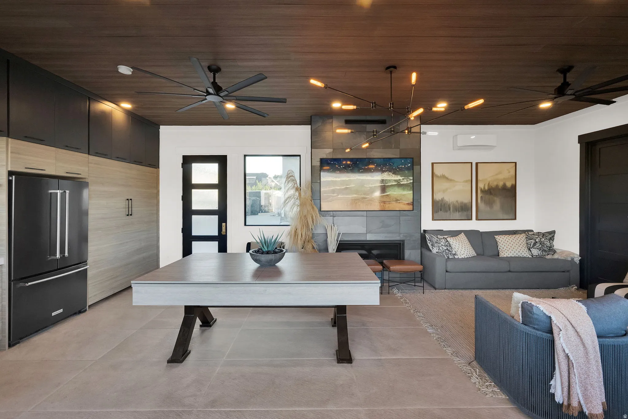 Open-concept living space with wood-finish ceiling
