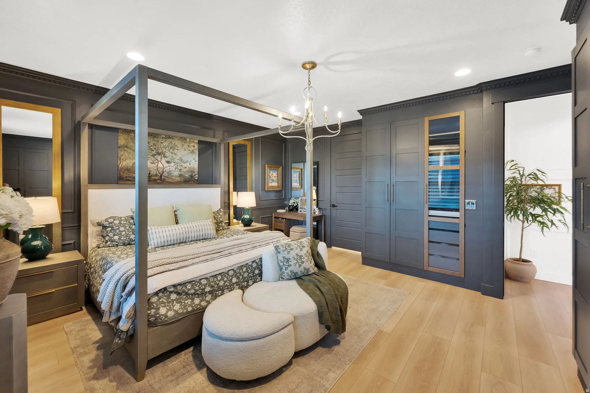 Dark-paneled walls featuring crown molding and recessed lighting