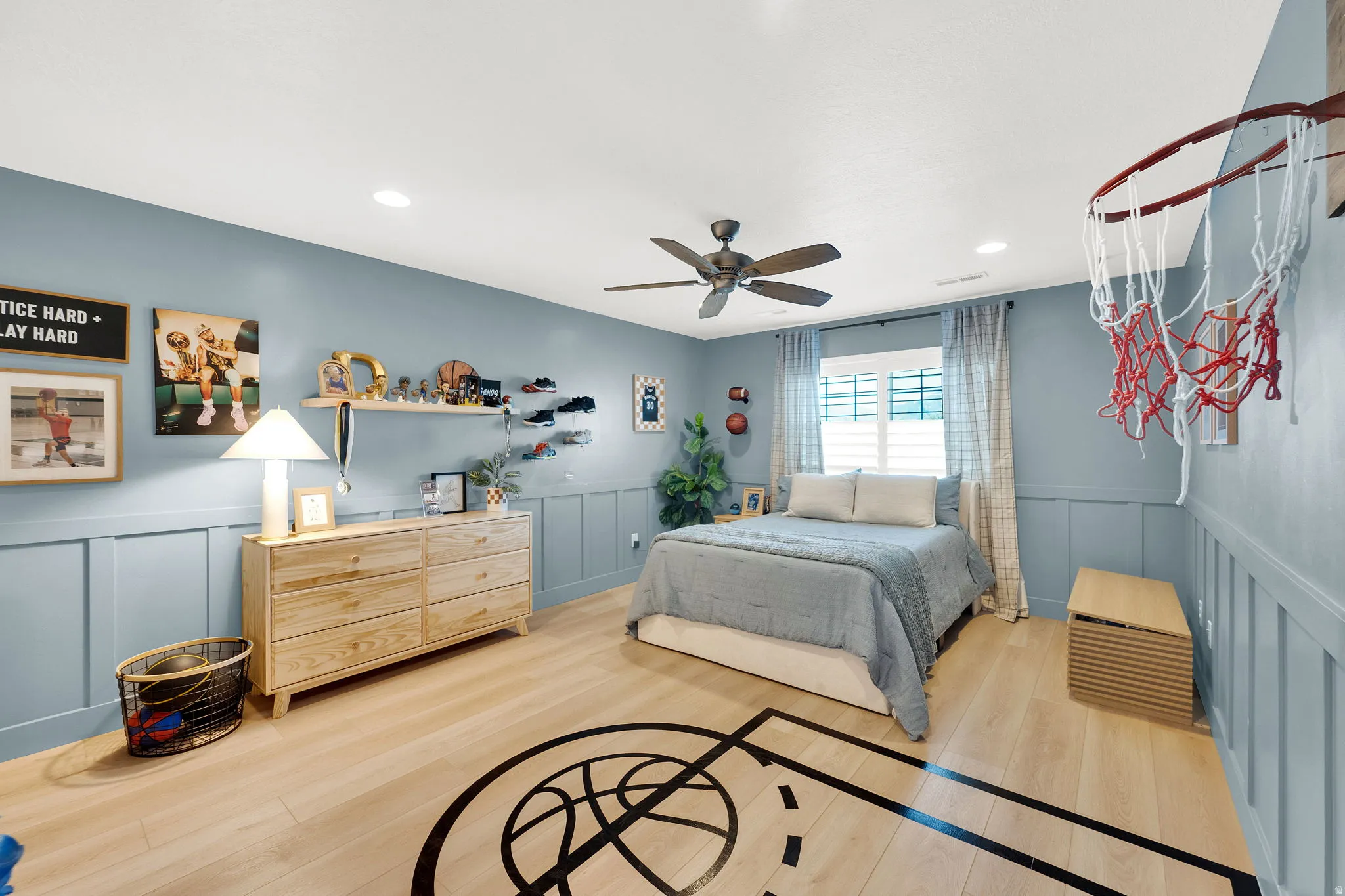 Room featuring light wood-finish flooring with a basketball court graphic, recessed lighting, and a ceiling fan