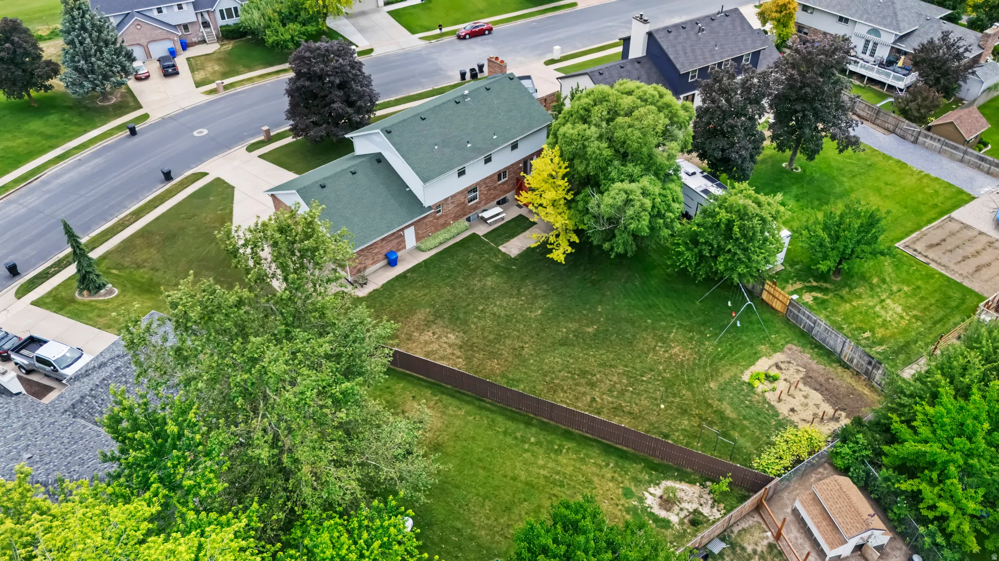 Two-story brick exterior with green roofing