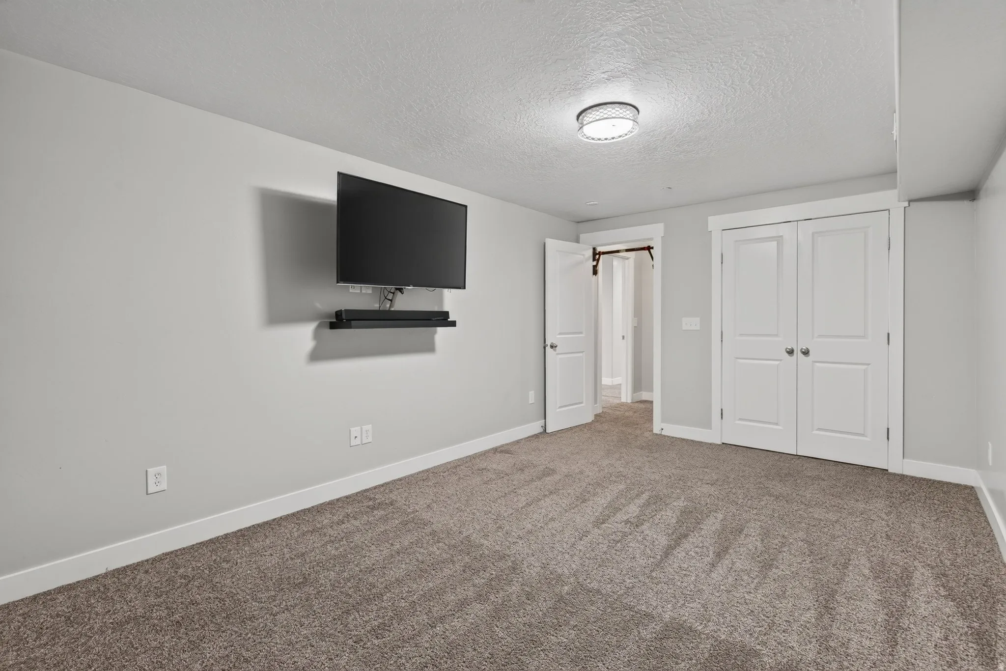 Basement level bonus room at the bottom of the stairs. Not included in basement bedroom count. Currently used as an exercise room.