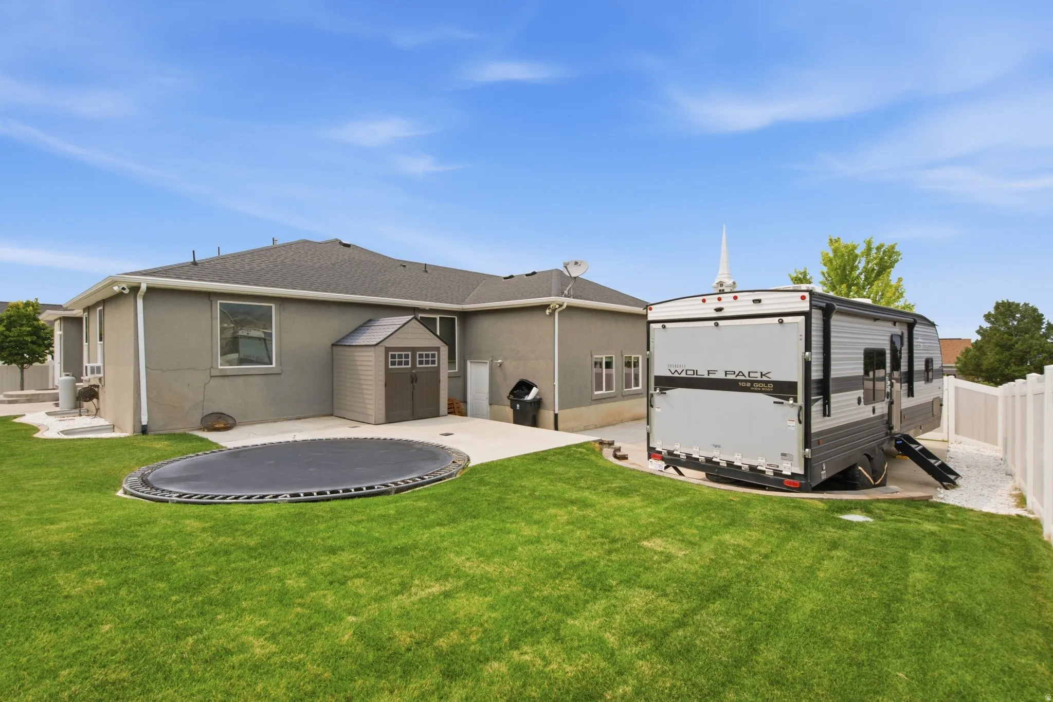 Built in trampoline (negotiable) and shed (included), with extra large RV Pad for additional toy storage.
