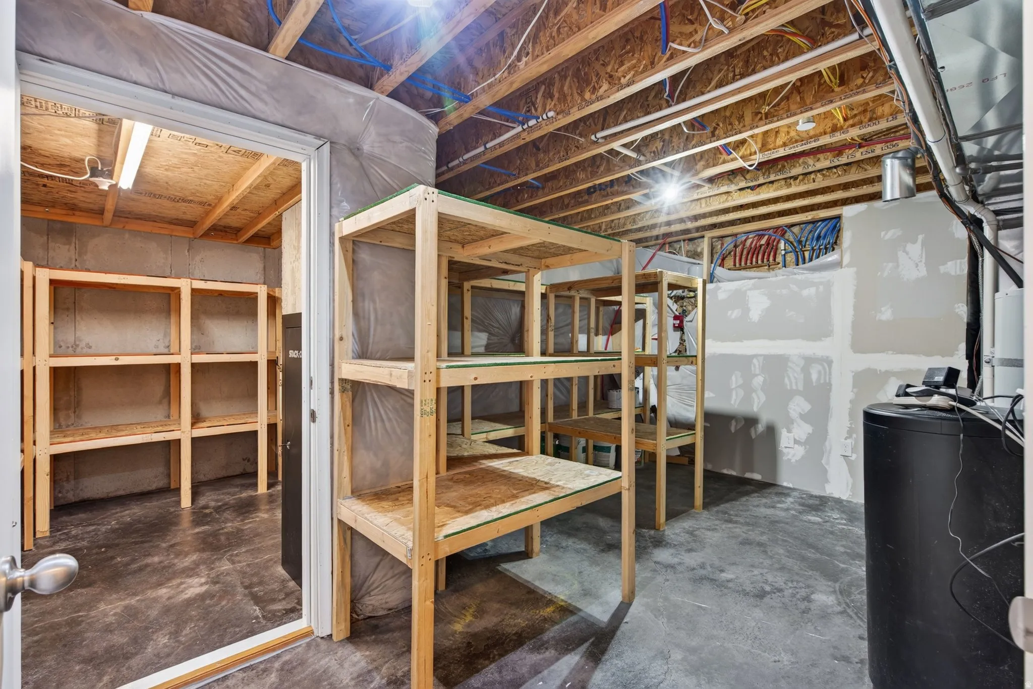 Huge storage space and utility room with separate large cold start room and gun safe.