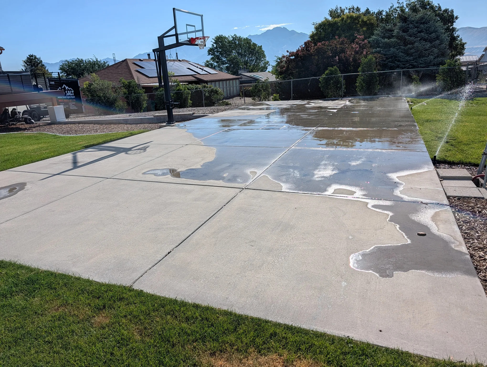 Expansive concrete pad/pickleball court with integrated basketball hoop