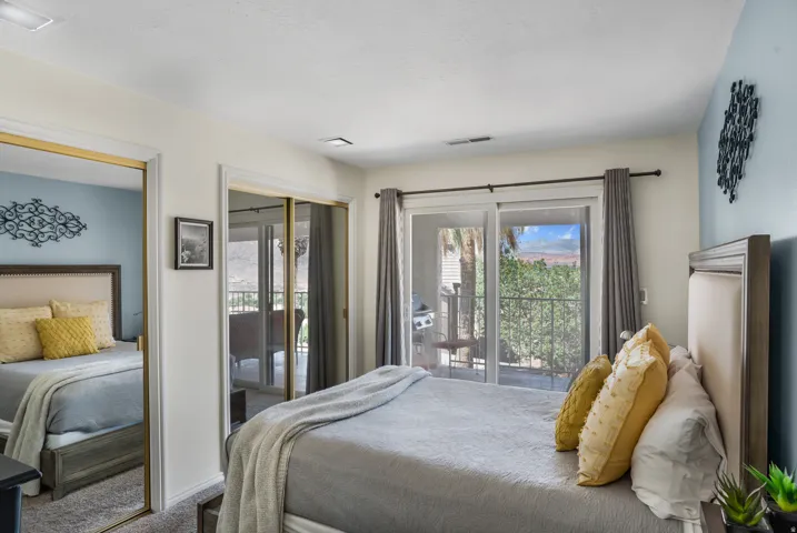 Bedroom featuring direct patio access through sliding glass doors.