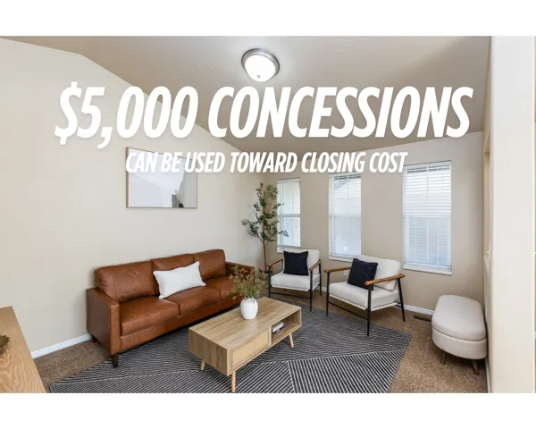 Interior space featuring vaulted ceilings, neutral wall tones, carpeting, and three windows equipped with horizontal blinds