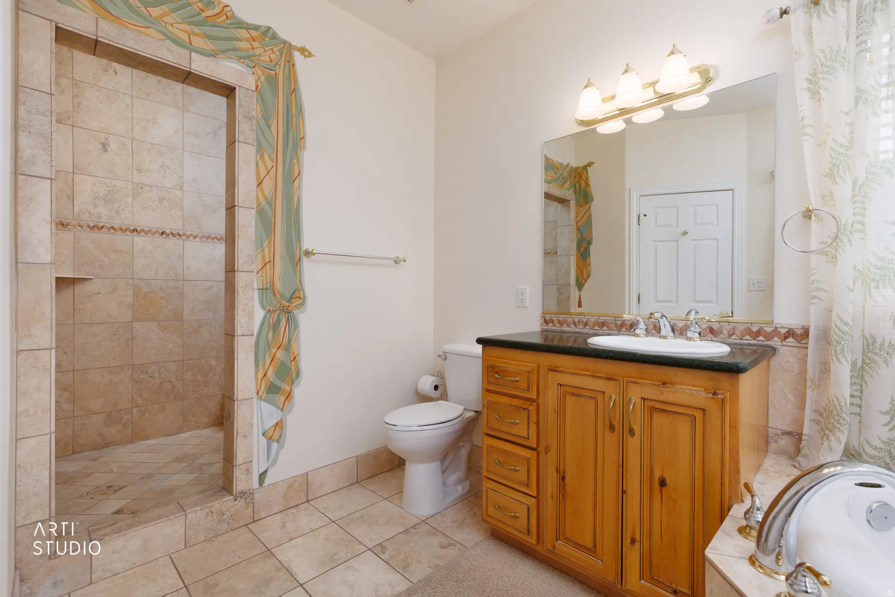 Master bathroom Walk-in shower with tiled walls and floor, vanity with wood cabinetry, dark countertop, and integrated sink, wall-mounted mirror, and a three-light fixture
