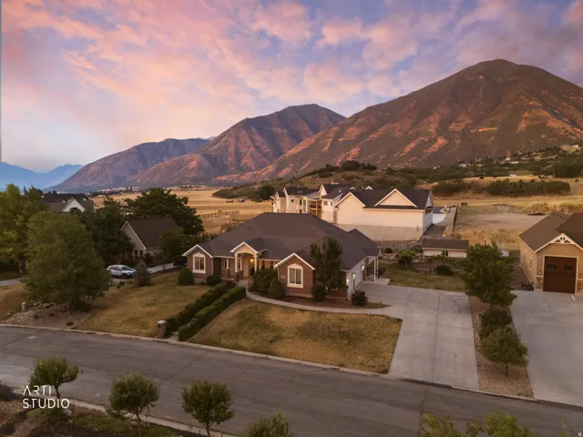 Ranch-style residence featuring a brick and siding exterior and an attached garage
