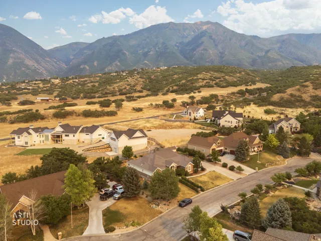 Expansive residential community featuring a variety of architectural styles, surrounded by natural terrain and foothills