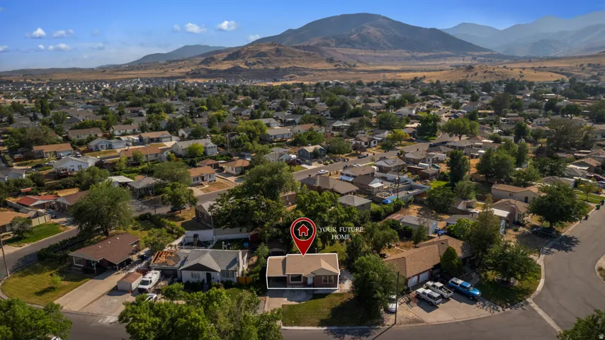 Suburban neighborhood featuring a variety of residential properties, mature trees, and street infrastructure