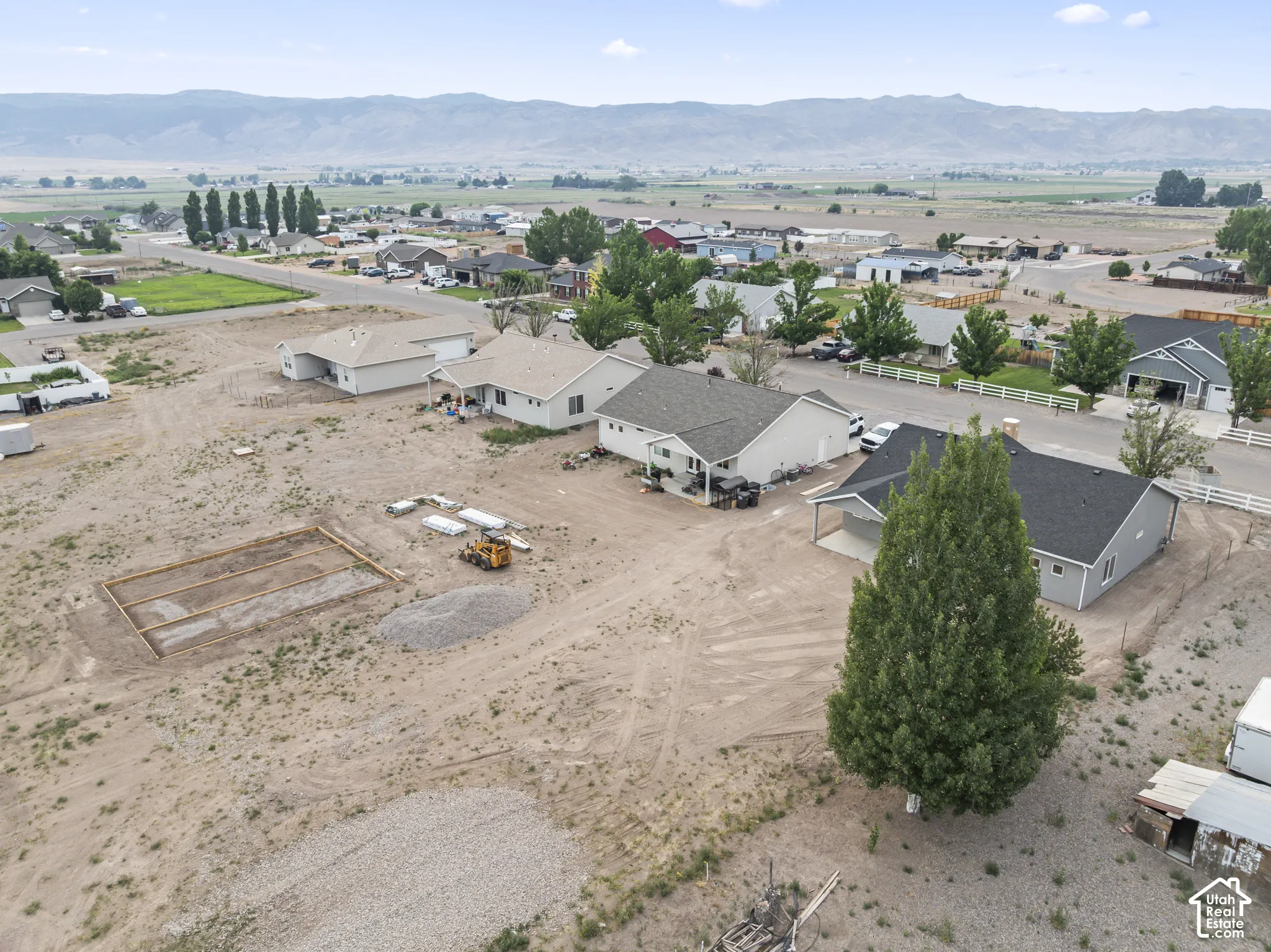 Expansive lot featuring a prepared building pad and mature trees