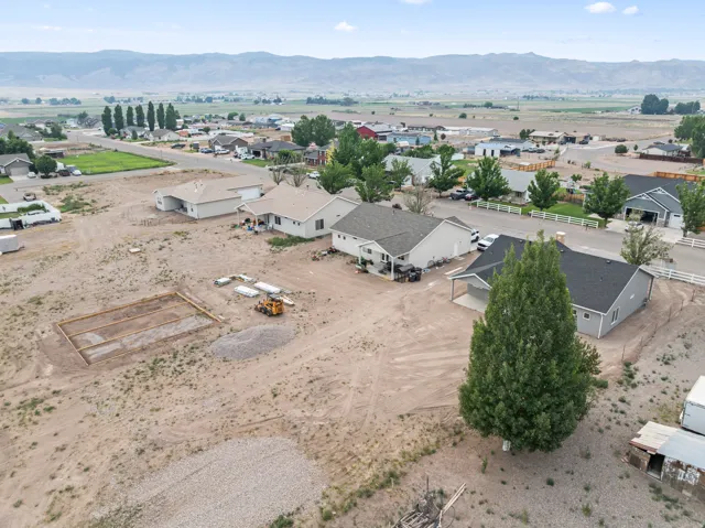 Expansive lot featuring a prepared building pad and mature trees