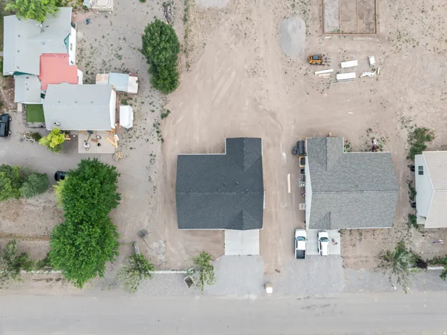 New construction home featuring a dark shingle roof and a concrete driveway