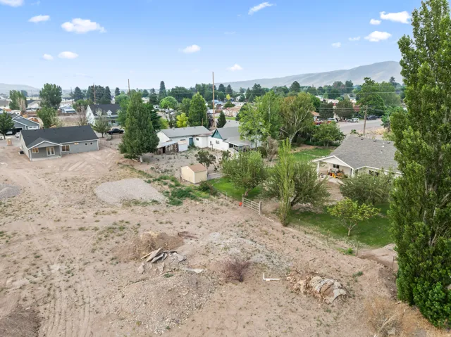 Expansive lot offering significant development potential, featuring clear terrain for construction