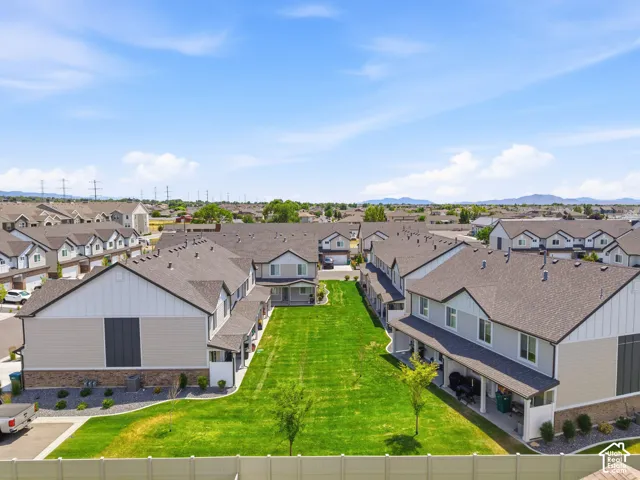 Expansive green space bordered by contemporary townhome-style residences