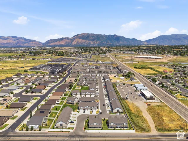 Aerial perspective showcasing a residential area with varied housing types, including single-family homes and multi-unit buildings