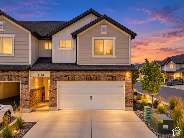 Brick and siding exterior with a two-car garage