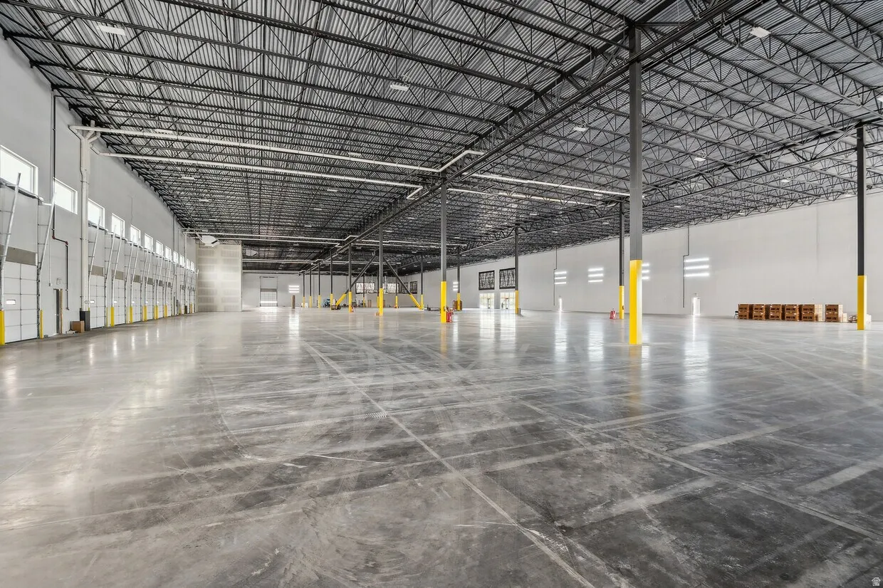 Spacious industrial warehouse featuring polished concrete flooring