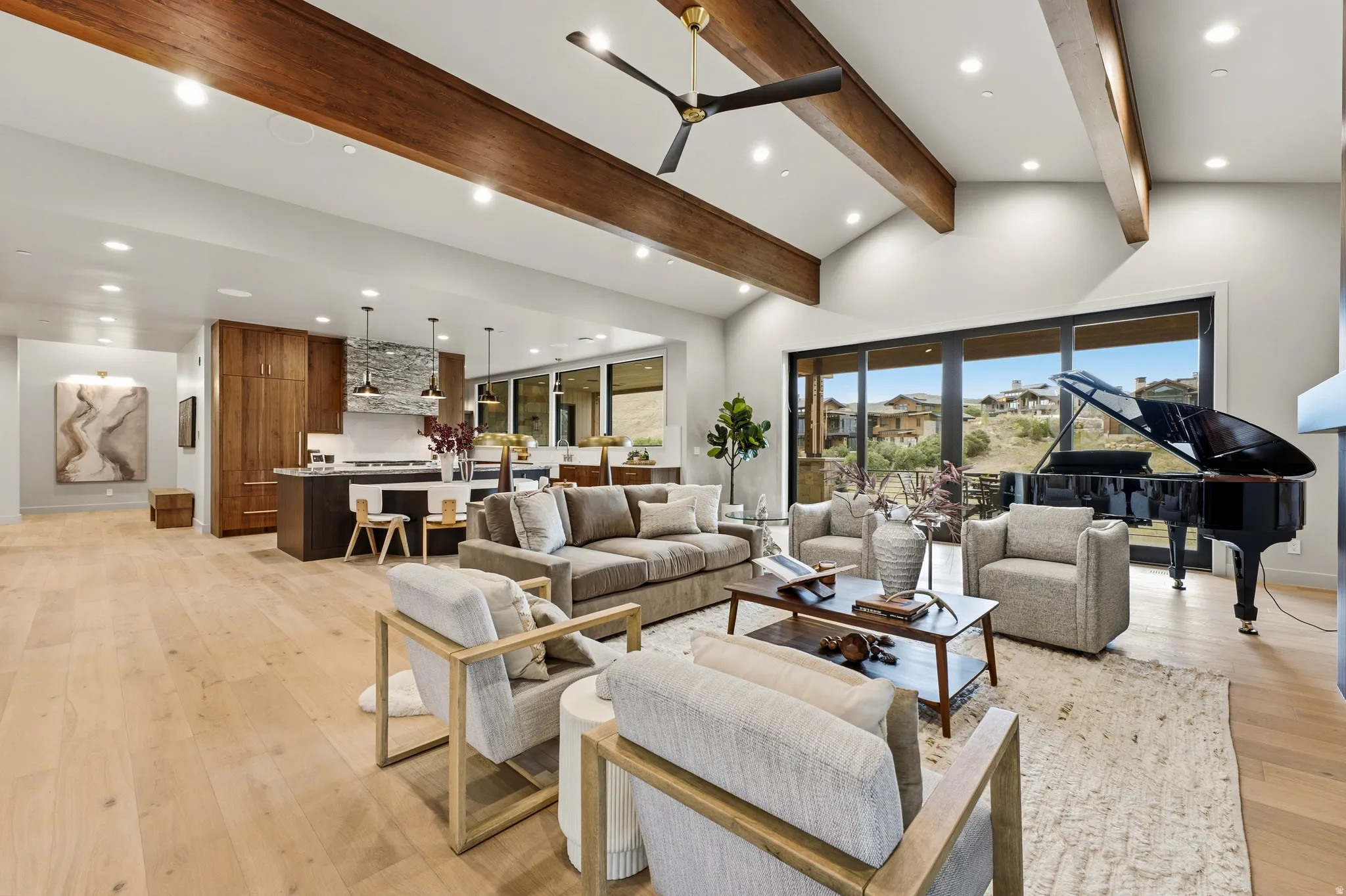 Vaulted ceilings with exposed wood beams, wood-finish flooring, recessed lighting, and a kitchen featuring a stone backsplash and pendant lighting
