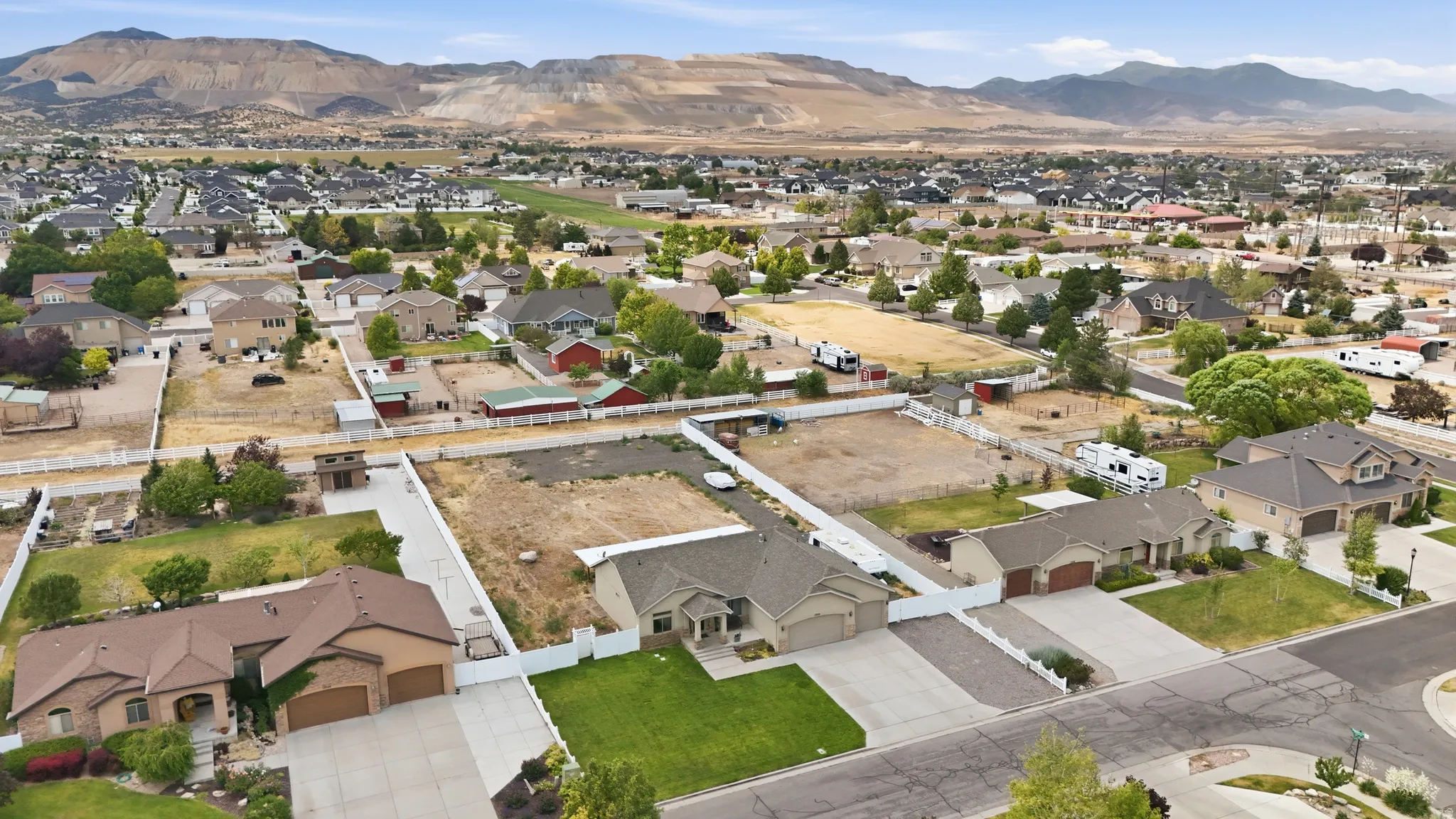 Residential community featuring a variety of properties with beige and brown stucco exteriors